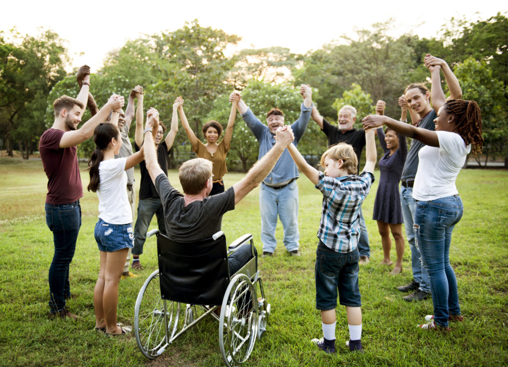 Group of people holding hands in a circle